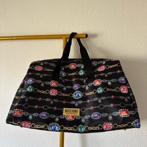 Moschino Fragrances Weekender Monogram Multicolor Travel Duffle Bag